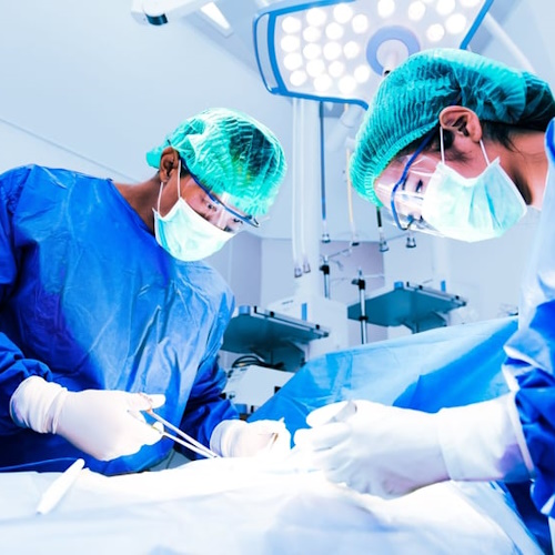 Surgeons over patient