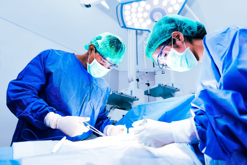 Surgeons over patient